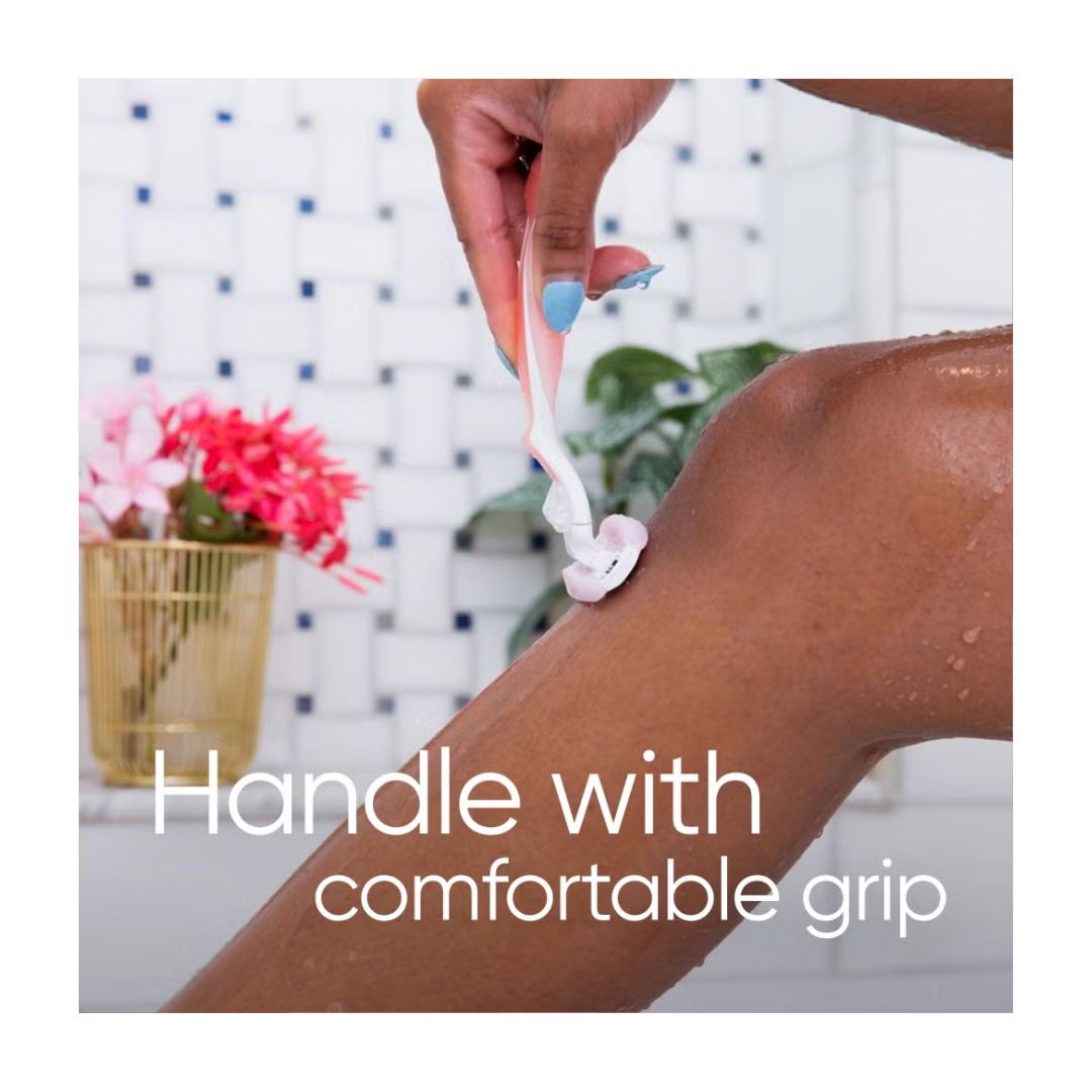 Gillette Venus ComfortGlide Spa Breeze Razor being used and captioned with 'Handle with comfortable grip'