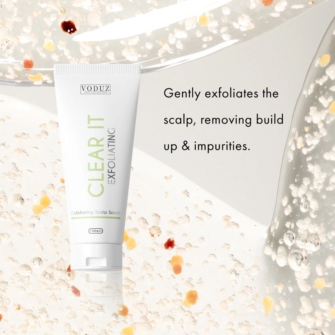 VODUZ Clear It Exfoliating Scalp Scrub in a white squeeze tube, displayed on a clean white background with decorative clear gel droplets and black descriptive text.