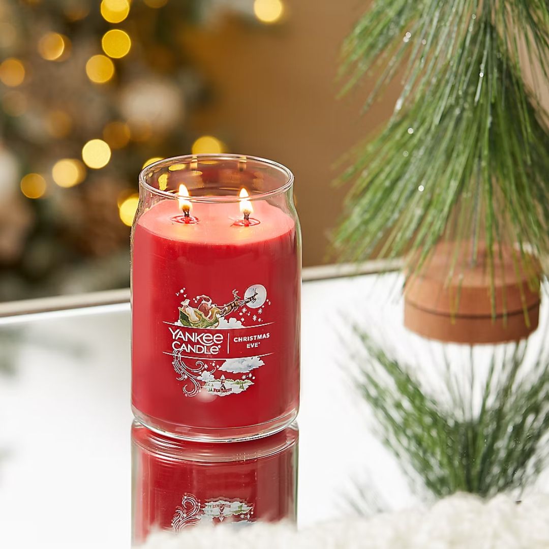 Yankee Large Christmas Eve Candle Jar on a coffee table