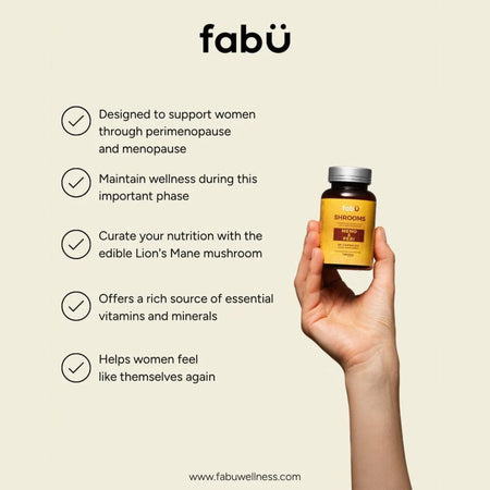 Hand holding a supplement bottle with text about fabö wellness on a beige background