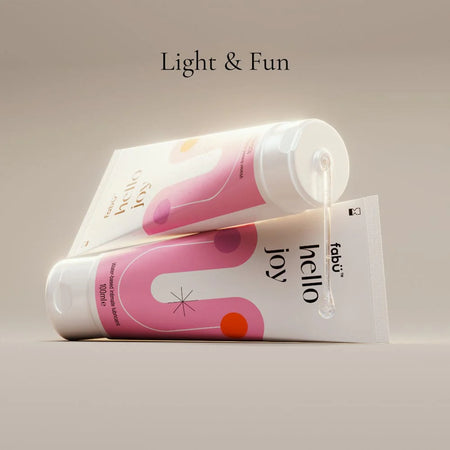 Two tubes of  FabU Hello Joy Water Based Intimate Lubricant 100ml
with 'hello joy' text on a beige background