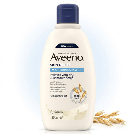 Aveeno Skin Relief Soothing Shampoo in a 300ml white plastic bottle with a dark blue cap, shown on a white background with wheat stalks at the bottom right.