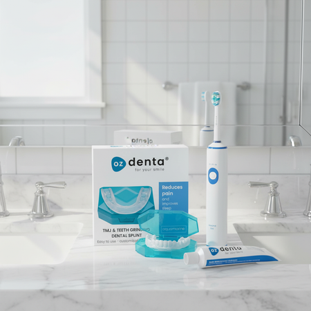 Oz Denta dental products including a box, splint, and toothbrush on a bathroom counter.