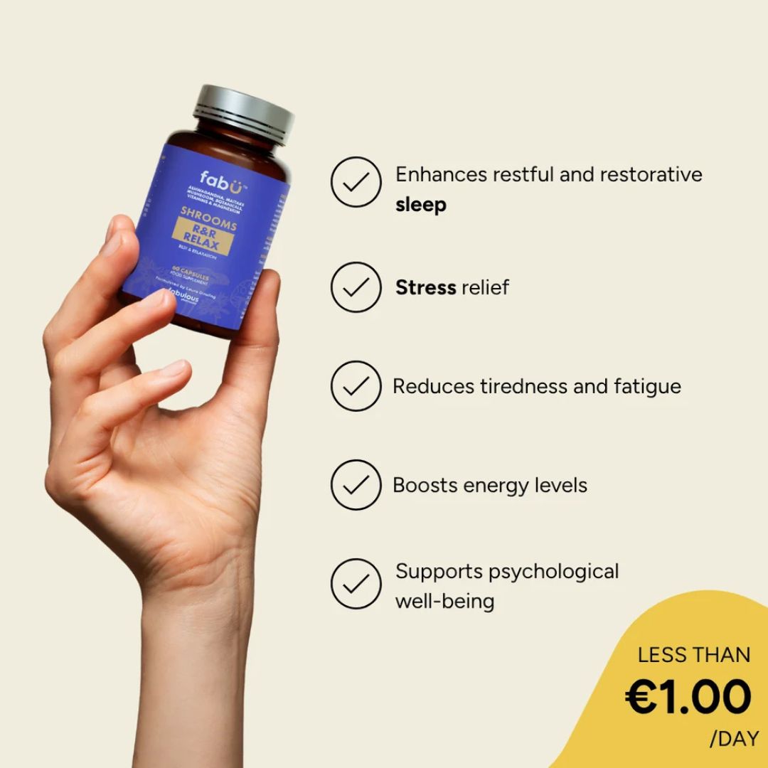 Hand holding a bottle of FABU Sleepytime Gummies with product benefits listed on a beige background
