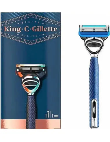 King C Gillette men's razor shown upright beside its retail box. The box is dark blue with metallic rose-gold accents and a printed image of the razor.