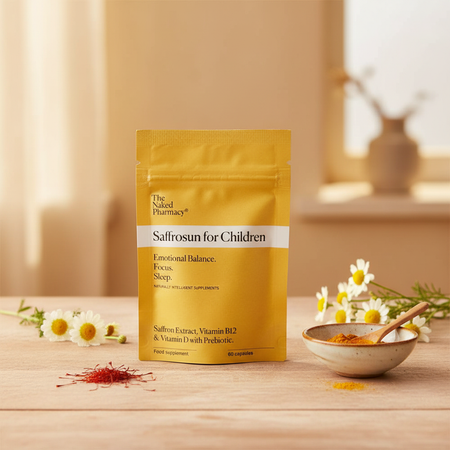 The Naked Pharmacy Saffronun for Children package on a wooden surface with saffron and flowers.