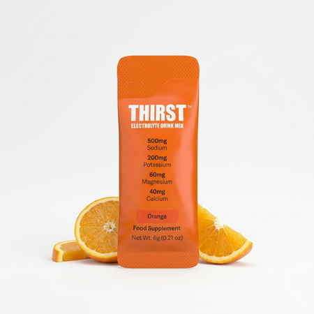 An orange stand-up pouch of Thirst Electrolyte Drink Mix stands upright on a white background, flanked by sliced orange wedges. The pouch is branded THIRST in white text, with product details listed below including electrolyte amounts and the Orange flavor.